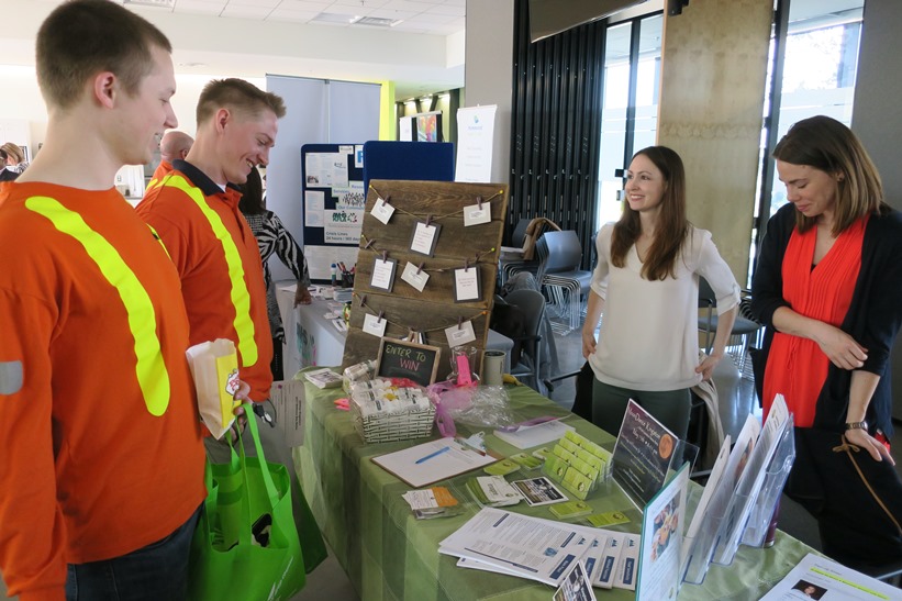 Employees and vendors chatting at Wellness Day