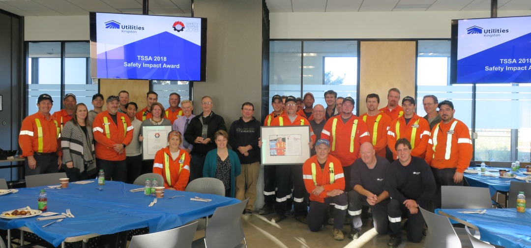 Utilities Kingston employees gather to celebrate the safety award.