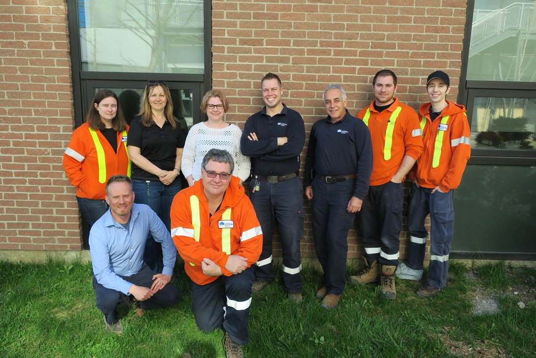 The water meter replacement team poses for a photo