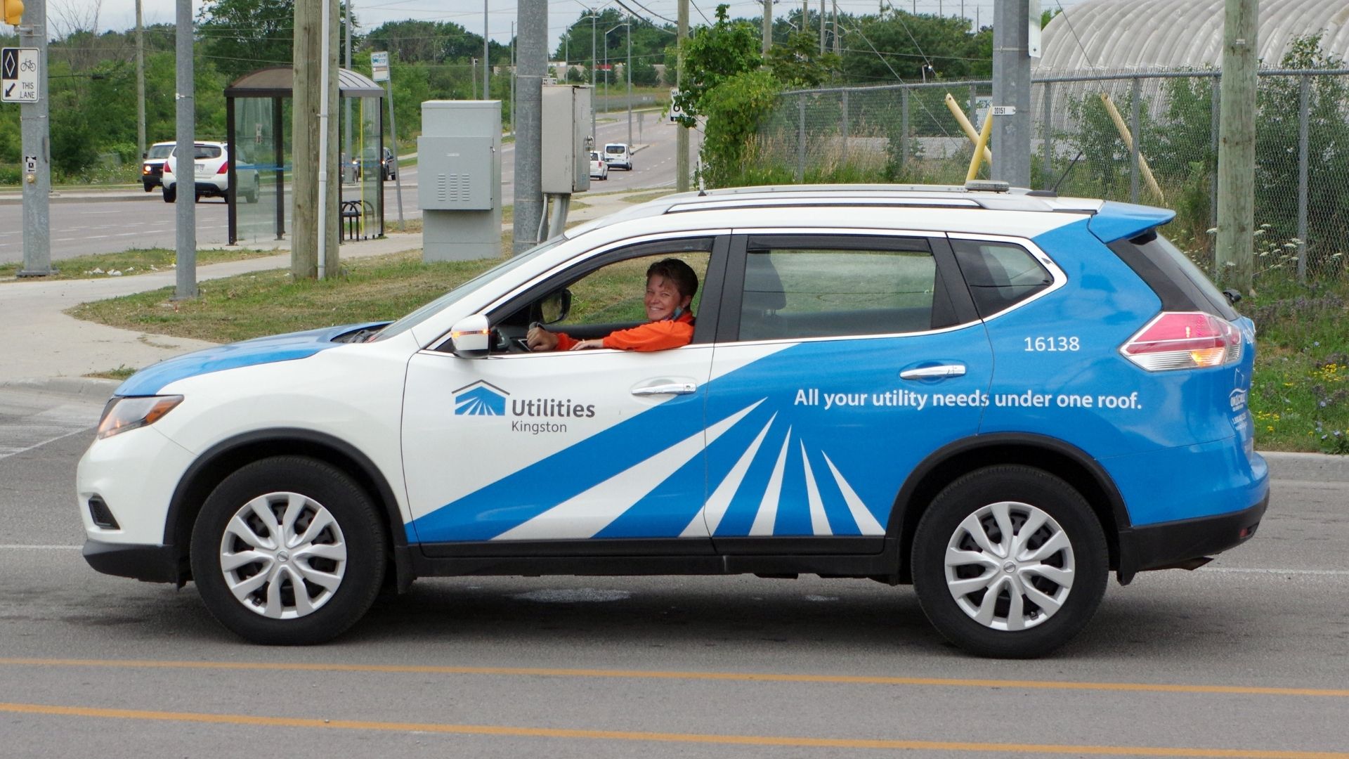Employee driving in a utilities vehicle.