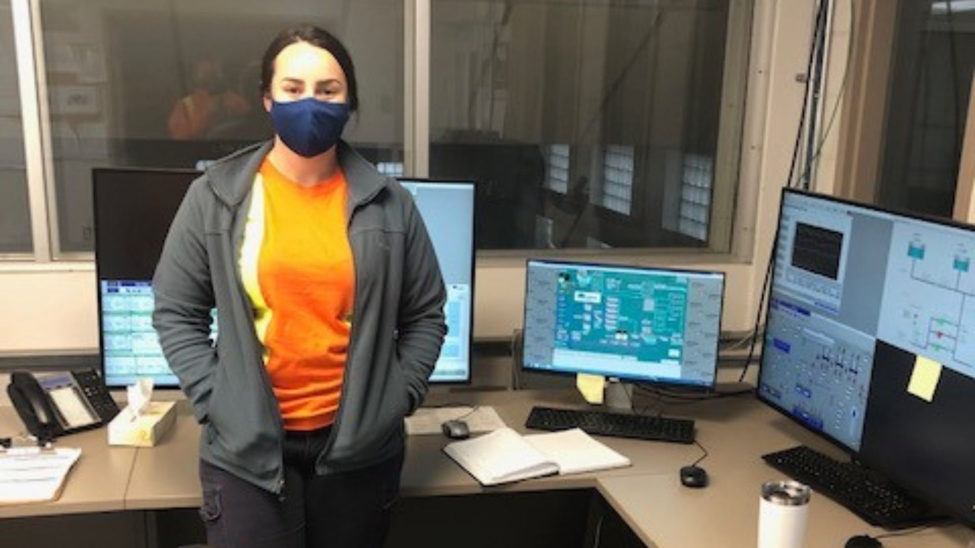 Treatment operator standing in a lab. 